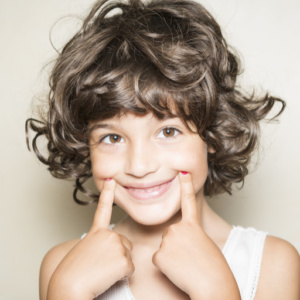 Choroby jamy ustnej, Gastromed, Grupa Scanmed, na zdjęciu uśmiechnięta dziewczynka